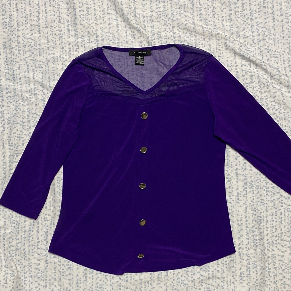 Liz McCoy purple blouse